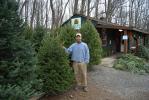 RON GOWER/TIMES NEWS Chris Botek, whose family owns Crystal Spring Tree Farm in Mahoning Township, stands next to Christmas trees on his farm. For the 13th time in 15 years, the farm is supplying the tree for the Capitol Rotunda in Harrisburg.