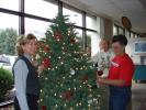 MARY TOBIA/SPECIAL TO THE TIMES NEWS Left to right: Barbara Hafer-Palmerton Concourse Club member, Trina Ely-Palmerton Hospital Auxiliary member and Barb Snell- Palmerton Concourse Club member have fun trimming a tree in the Blue Mountain Health…