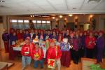 Members of the Schuylkill-Carbon Marine Corps League Detachment 629, kneeling left to right, James McHugh, Leon Frohnheiser, Eddie Glassic, picked up the toys the ladies of the Laurel Blossoms of the Red Hat Society collected to donate to the Marine…