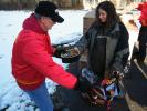 ANDREW LEIBENGUTH/SPECIAL TO THE TIMES NEWS Schuylkill Carbon Marine Corps League Commandant James Laub, left, gives a new bike and Salvation Army ham to Sheila Sherry of Lehighton during the Schuylkill Carbon Marine Corps League Toys For Tots and…