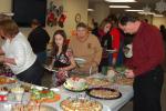 TERRY AHNER/TIMES NEWS Visitors enjoy a hot meal as part of the Family Christmas Party held Saturday at the Village at Palmerton.