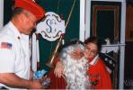 SPECIAL TO THE TIMES NEWS Voula Kalamaris of Slatington, and a former Dream Come True recipient, accepts a toy from George Rondeau, while sitting on Santa Claus' lap at the Carbon-Mountaineers Marine Corps League Detachment 996 needy dinner.