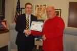 TERRY AHNER/TIMES NEWS Outgoing Palmerton Area School District solicitor Steven Serfass (left) receives a citation from school board President Barry Scherer (right) on Tuesday. Serfass, who was elected as the Third Judge in Carbon County, served as…