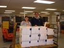 MARY TOBIA/SPECIAL TO THE TIMES NEWS St. John's Episcopal Church families sent care packages to thirteen military soldiers. Left to right-Deb Craig, Junior Warden of St. John's and Rich Wasser, Palmerton Postmaster finish the paper work for each box…