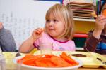 CHRIS PARKER/TIMES NEWS Autumn Stepp enjoys a slice of fresh carrot during lunch at the Carbon County Head Start program in Lehighton.
