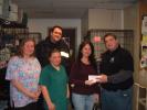 DAVID WARGO/SPECIAL TO THE TIMES NEWS Carbon County Friends of Animals staff members (left to right) Jerilynn Derhammer, Melissa Holland and Darlene Zehner accept a $200 check from Blue Mountain Paranormal Society co-founder Bob Schaeffer (on right)…