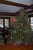 LINDA KOEHLER/TIMES NEWS  Ann Behler sits next to the nine-foot Frazer Fir Christmas tree that husband, Andy insists they have to have. It takes her six hours to decorate. But it is a labor of love.