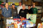 LINDA KOEHLER/TIMES NEWS Left to right: Charlie Silliman, coordinator of CACPAC, Dell Swartz, CACPAC volunteer, Linda Swartz, president of CACPAC, are ready to stock the CACPAC shelves with groceries they were able to buy from money that was donated…