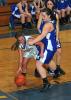 STEVE SHINKO/Special to the TIMES NEWS Marian's Angela Bellezza tries to get inside the defense of Minersville's Casey Brophy during Monday night's girls basketball game at Marian.