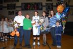 Ron Gower/TIMES NEWS Amy Zehner, third from left, is congratulated by family members after she scored her 1,000th point in varsity basketball, Thursday. From left are her parents, Mel and Judy Zehner; her sister, Lori; nephew, Judge Gusick, who is…