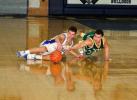 BOB FORD/TIMES NEWS Marian's Cody Decker (left) and Notre Dame of East Stroudsburg's Mike Aldaron battle for a loose ball in the District 11 Class A Boys semifinal on Tuesday night at Northern Lehigh.