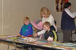 VICTOR IZZO/SPECIAL TO THE TIMES NEWS Looking over some of the hundreds of books available at the book swap held during "Family Fun Night" at the Penn Kidder Campus of the Jim Thorpe Area School District are Austin Fronheiser, age 4 (left) and his…