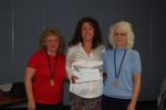 LINDA KOEHLER/TIMES NEWS Tammy Graeber, center, of Saylorsburg's Garden of Giving, accepts a check donation in the amount of $1,166.60 from Stroudsburg's Fraternal Order of Eagles' Ladies Auxiliary's head of the finance committee, Jackie Nevil, left…