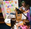 ANDREW LEIBENGUTH/SPECIAL TO THE TIMES NEWS Rush Elementary students learn how to hatch chicks during the Rush Elementary School Science Showcase held in Hometown Wednesday evening. Pictured holding chicks from lower left are Kendra Kunkel, 6, and…