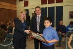 LINDA KOEHLER/TIMES NEWS Penny Derr, PVE Principal, left, and Joshua Krebs, PVE Assistant Principal, center, presented a framed copy of the winning picture in the "Design the School Logo Contest" by the Curriculum Committee of the Pleasant Valley…