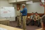 CHRIS PARKER/TIMES NEWS David G. Lear, left, project manager for the solar park planned by Green Energy Capital Partners, listens as Kovatch Enterprises attorney Steve Cormier explains the project to the Nesquehoning Zoning Hearing Board on…
