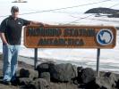 John Orsulak of Nesquehoning poses next to the Welcome to Mcmurdo Station sign in Antarctica.