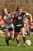 MIKE FEIFEL/TIMES NEWS Emily Iobst (21) of Northwestern tries to get past Northern Lehigh's Victoria Tadman-Ubele during Monday's Colonial League soccer match.