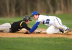 bob ford/times news Northwestern's Tim Schaeffer dives back into first base as Palmerton's Jesse Reis applies the tag.