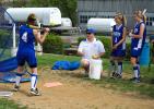 BOB FORD/TIMES NEWS Palmerton head softball coach Glenn Reimer works with Michelle Rickert on her hitting as teammates Vicki Graver and Katie Reimer look on.
