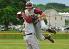 Lehighton's Dave Behler, left, lifts up pinch-runner Steve Shanton after he scored the game-winning run on a Tyler Harris single in the bottom of the eight inning Wednesday against Pocono Mountain West. With the win, the Indians advance to today's…