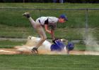 Rich Chartrand/Special to the TIMES NEWS Pleasant Valley first baseman Pat Kregeloh tags out Kyle Dauscher of Nazareth during Thursday's District 11 playoff game at Coplay.