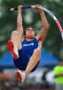 bob ford/times news Palmerton's Danny Buck eyes the bar as he lauches himself skyward in the pole vault. Buck captured a PIAA Class AA gold medal on Friday.