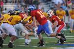 NANCY SCHOLZ/TIMES NEWS Palmerton's Joe Weber rushes the quarterback from his defensive end spot on the Red team during Thursday's All-Star game.