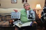 AMY ZUBEK/TIMES NEWS Joe Kalista displays a family photo of Casimir and Mary (Novak) Kalista; as well as a copy of his grandfather's naturalization papers from when he became a naturalized citizen on June 14, 1926. These were two of the many items…