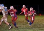 bob ford/times news Jim Thorpe running back Shane Edwards (27) takes the handoff from quarterback Sean Green (13) and runs behind a block thrown by Ryan Gregoire (60).