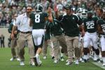 Lehighton native Dave Warner, now in his fifth year on Mark Dantonio's staff at Michigan State as the quarterback coach, gives Spartans quarterback Kirk Cousins a high five after he threw a touchdown pass in a recent game. Photo courtesy of Michigan…