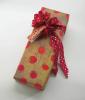 AP PHOTO/JON VAN GORDER This product imageshows brightly dotted paper complimented by a ribbon with smaller dots, a creation by Susan Swan from the book "Wrapped with Style," Universe Publishing, 2009. A gift-giver's thoughtfulness is as apparent in…