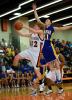 bob ford/times news Weatherly's George Wallish drives hard to the basket as Marian's Chris Barletta defends.
