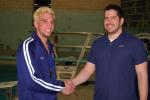 JOE PLASKO/TIMES NEWS Tamaqua senior Dane DeWire (left) is congratulated by Blue Raiders coach Eric Lech after DeWire earned the 1,000th point of his swimming and diving career.