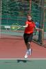 ron gower/times news Northwestern's Henry Paiste leaves his feet to power a forehand shot during Saturday's action at the District 11 Class AA Tennis Tournament.