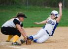 BOB FORD/TIMES NEWS Marian's Kayla Knight slides into third base safely as Panther Valley's Krista Knepper covers.
