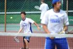 Pleasant Valley's Joe Osinski (left) returns the ball as teammate Vince Voulo waits at the net. The Bears' doubles team dropped a 3-6, 7-5, 6-3 decision in the opening round of the District 11 Class AAA doubles tournament on Friday.