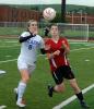 ron gower/times news Dana McAllister of Pleasant Valley, left, and Camille Roberts of Parkland both pursue ball.