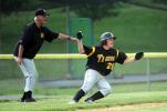 Nancy Scholz/special to the times news Northwestern coach Len Smith (left) watches the action on the field and directs baserunner Tyrone Williams back to third base.