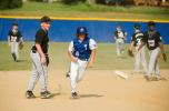 bob ford/times news Tamaqua's Thad Zuber (6) heads to third base after escaping a rundown against Stroudsburg. In the background, the Stroudsburg right fielder chases after the ball that was thrown over the second baseman's head.