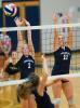 BOB FORD/TIMES NEWS Tamaqua's Rebecca Minehan attempts to block a shot with teammate Devan Sweeney (right) during Tuesday's match against Blue Mountain. The Eagles won in three straight games.