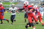 Jim Thorpe's Khaaliq Lynch (19) runs with the ball after catching a pass in the second quarter against Schuylkill Haven. Coming toward him is the Hurricane's Brandon Cooper (40).