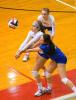 BOB FORD/TIMES NEWS Marian's Emily Pilla (left) and Lauren Nietz (in blue) both go to hit the ball as teammate Nikki Collevechio looks on from behind.