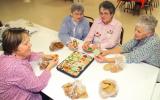ANDREW LEIBENGUTH/TIMES NEWS Sitting with their homemade cookies during a recent fundraiser at Christ Church in McKeensburg are volunteers, from left, Susan Mantz, Dorothy Faust, President Helen Koch and Nancy Shellhamer.
