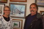 TERRY AHNER/TIMES NEWS Diane Danielson, director, Palmerton Area Library, and artist Douglass Wilkins, of Neola, showcase a painting of an old mill in Sciota (center) that Wilkins submitted for the library's sixth annual Art Show on Sunday. The…