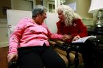AP Photo/Charles Dharapak Alexis McKenzie, right, executive director of The Methodist Home of the District of Columbia Forest Side, an Alzheimer's assisted-living facility, shares a light moment with resident Catherine Peake recently. Dementia can…