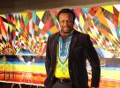 AL ZAGOFSKY/SPECIAL TO THE TIMES NEWS Award-wining African artist and Arts Ambassador for Nigeria to the United Nations Ibiyinka Alao with his painting The Eagle. Alao 's exhibition, Eternity in Our Hearts opens Feb. 21 at the Mauch Chunk Museum.