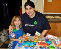 Albrightsville Troop 30137 Daisy Olivia Rosenberger and her mother Lisa stand by her entry "Candy Circus" which won Most Creative at the Service Unit 309, 2012 Girl Scout Bake Off which was held at Saint John's Lutheran Church on North Street in Jim…
