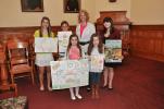 AMY MILLER/TIMES NEWS First place winners of the Carbon County Conservation District's 37th annual poster contest stand with Audrey Wargo, district secretary, second from right, during the recent awards ceremony. Winners are, front row, from left,…