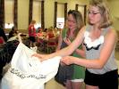STACEY SOLT/SPECIAL TO THE TIMES NEWS Jackie Malloy, left, secretary of the Mahoning Valley 4-H Community Club, and Elyse Kistler, club vice president, organize clothing donated by club members during their June meeting. Club members aimed to donate…